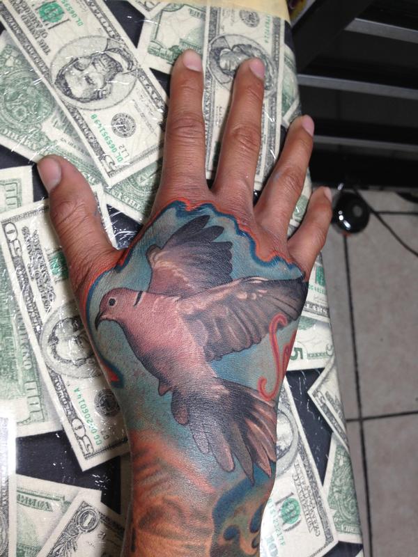 Urban Rock Realistic dove hand tattoo