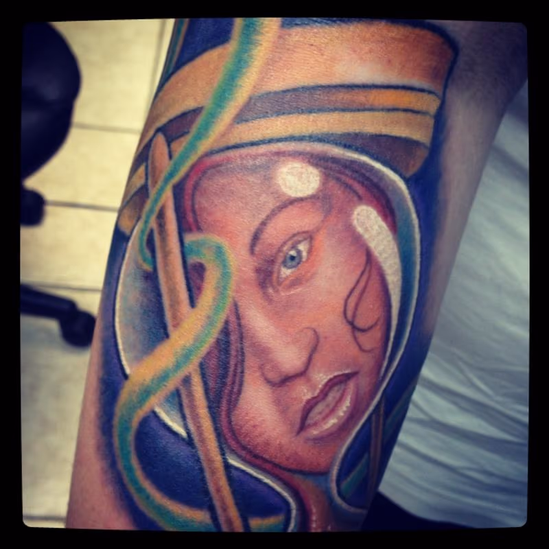 Girl in an hourglass tattoo close-up