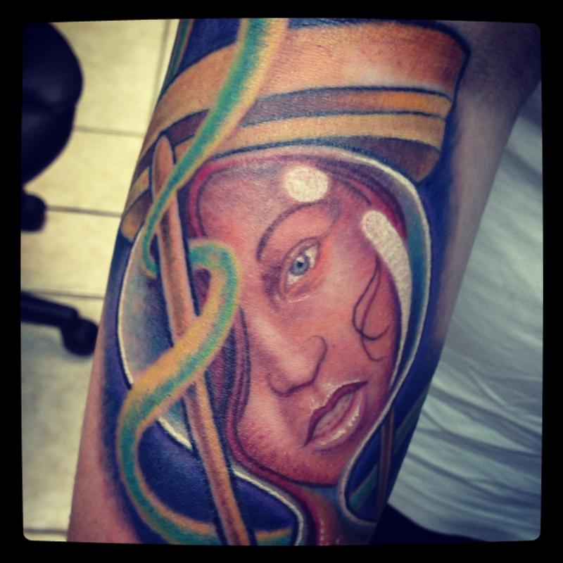 Girl in an hourglass tattoo close-up