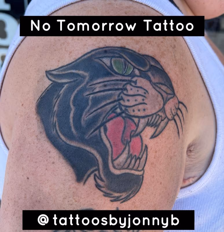 "A classic American traditional tattoo featuring a striking black panther."