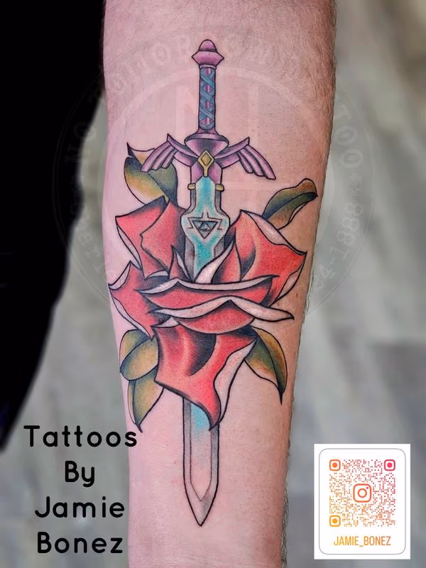 "Legendary Zelda Sword Meets Classic American Rose Tattoo Design"