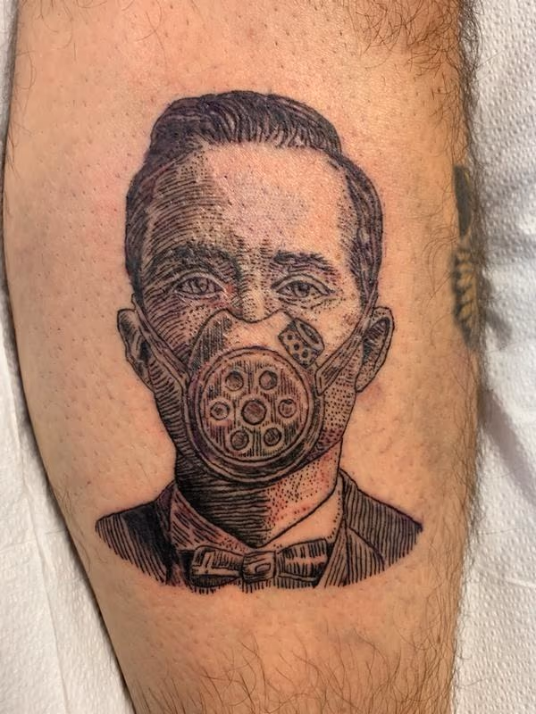 This is a depiction of an old gas mask featured in a newspaper advertisement from the 1940s, which was included in a Pearl Jam album.