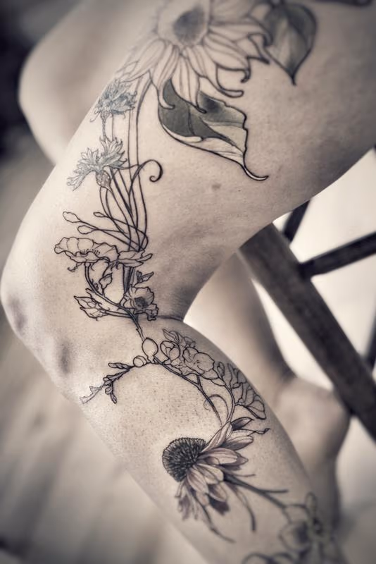 echinacea wild rose corn flower sunflower floral leg tattoo