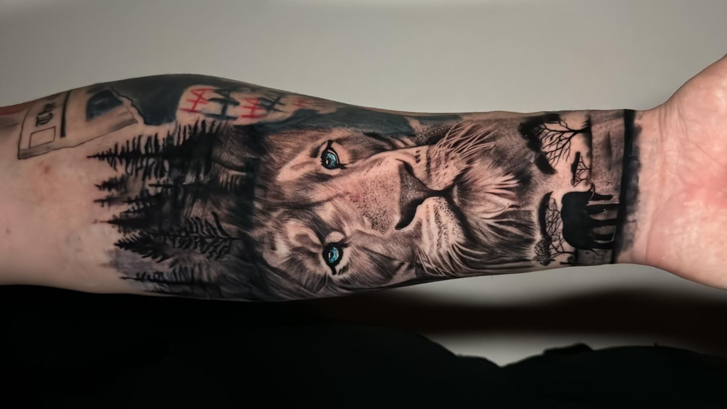 Lion Tattoo With Blue Eyes by Guiohans