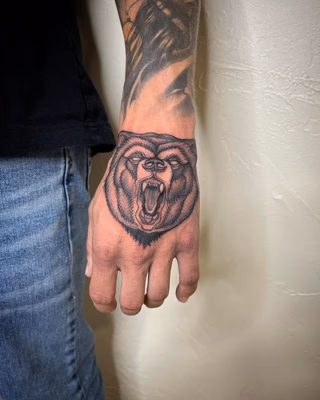Brennan Walker Bear Hand Tattoo