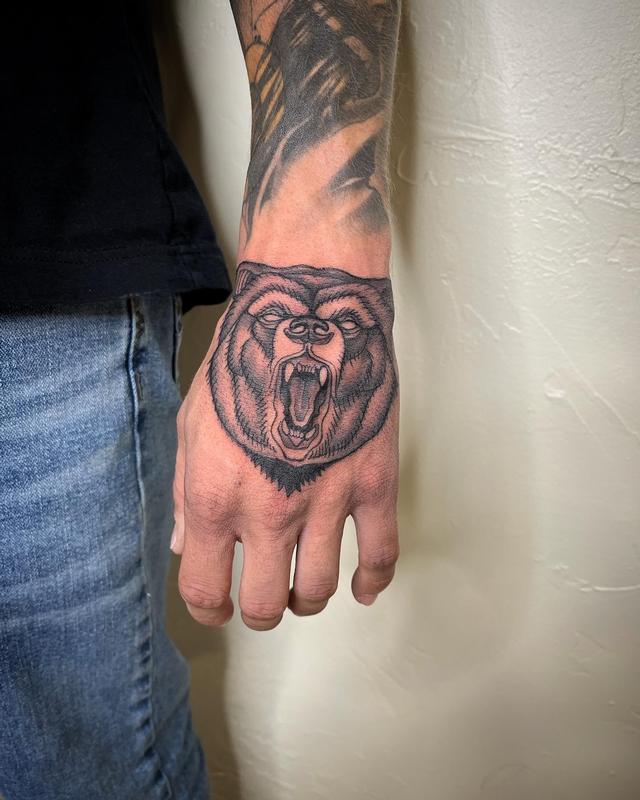 Brennan Walker Bear Hand Tattoo