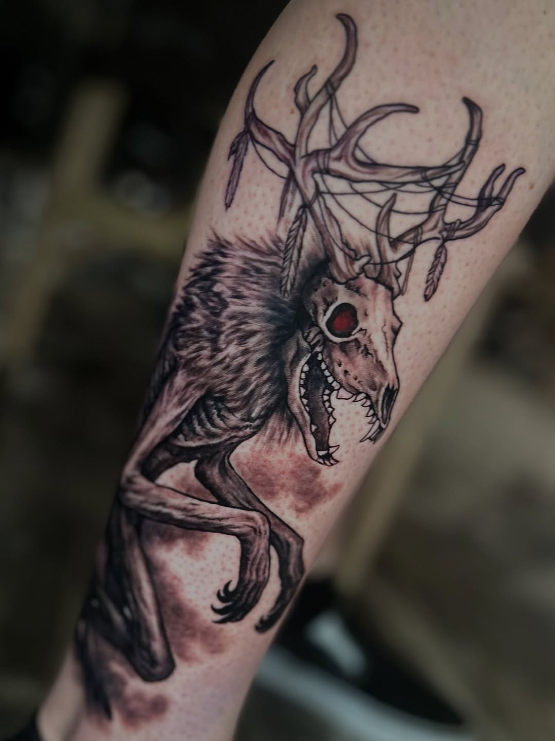 Wendigo creature with antlers, forearm