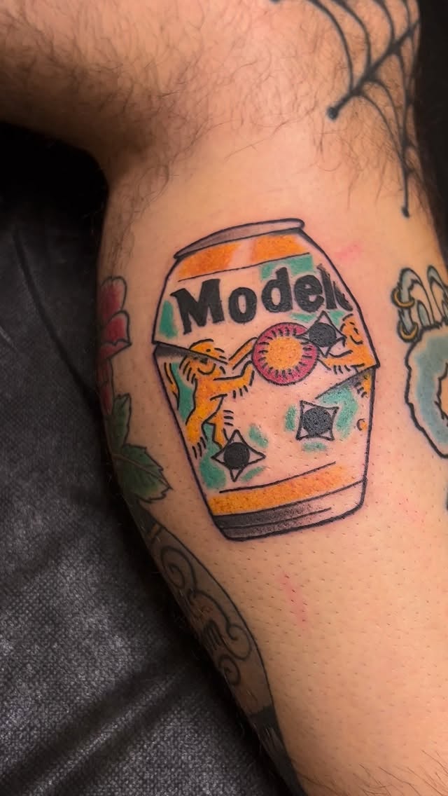 Model beer can tattoo, colorful arm