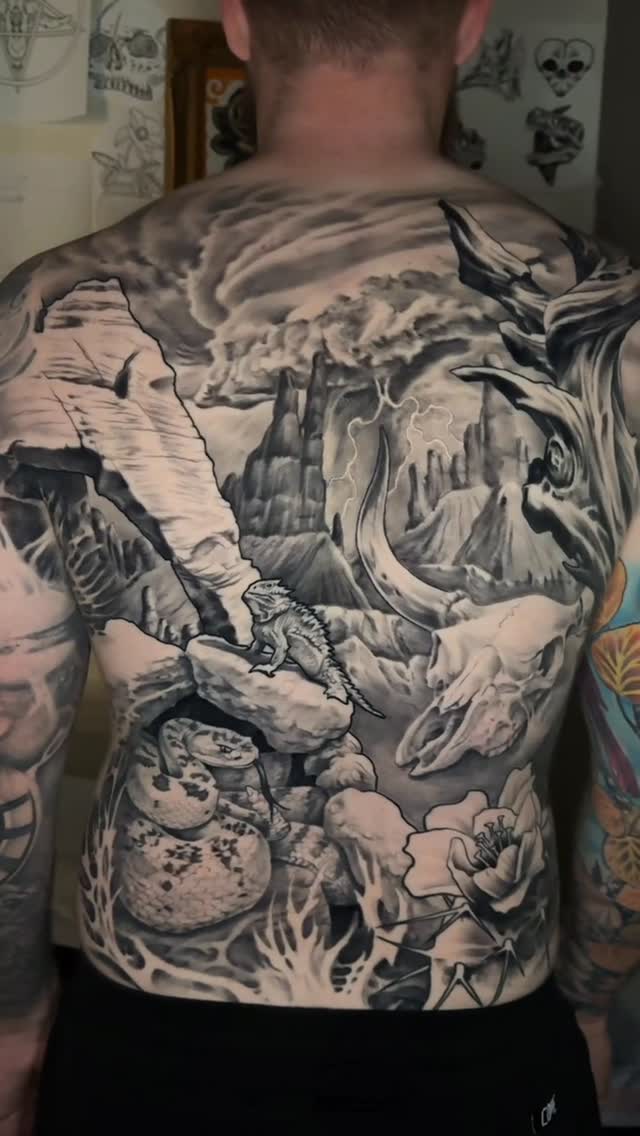 Black-and-grey wildlife back-piece tattoo