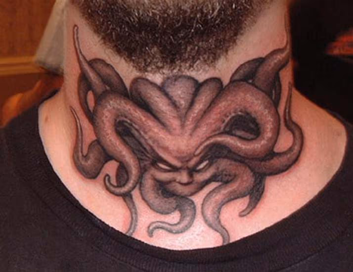 Demon tattoo on throat