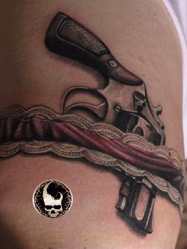 Gun in garter Tattoo