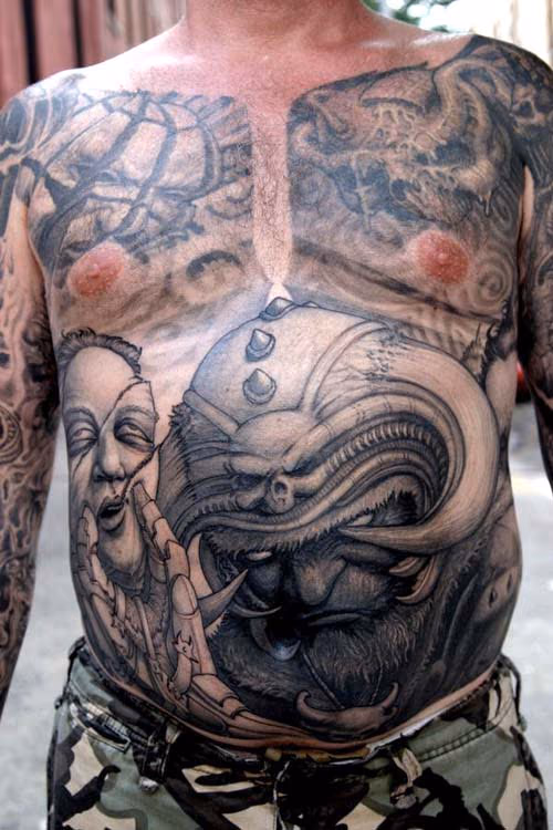 Horned helmet demon stomach tattoo