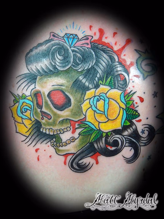 Skull with roses and a diamond bow.