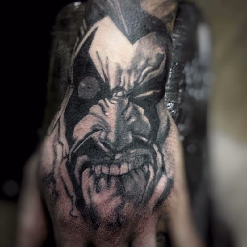Black and Gray Cartoon Portrait Tattoo