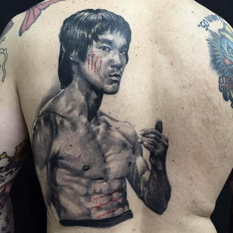Black and Gray Bruce Lee Portrait Tattoo