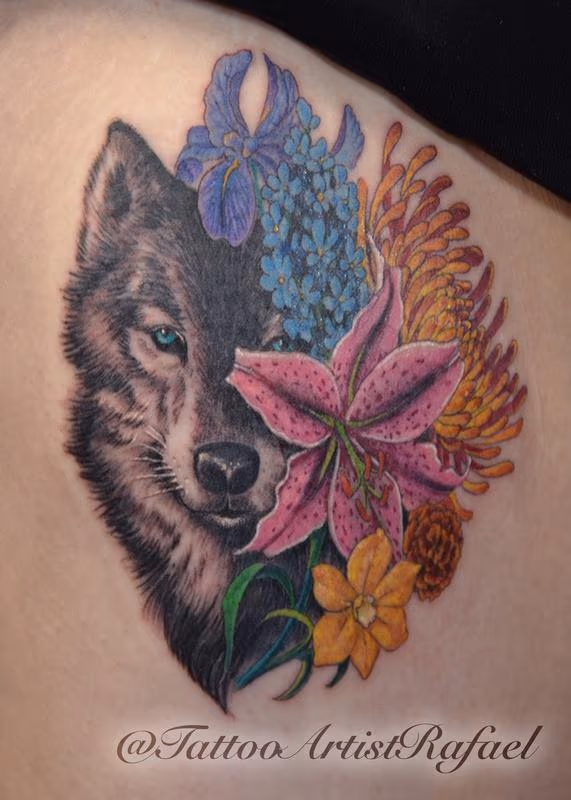 Realistic Wolf face with colored flowers