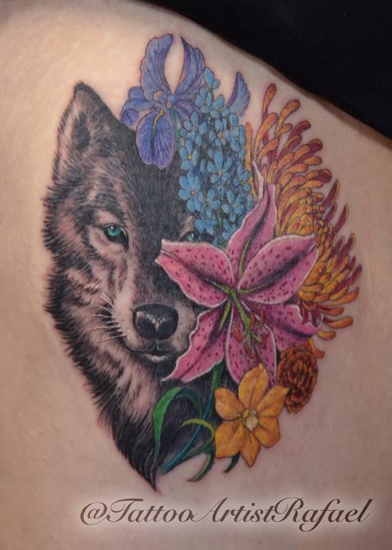 Realistic Wolf face with colored flowers