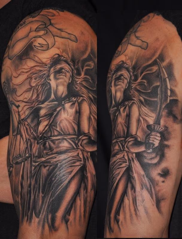 Lady Justice in black and grey