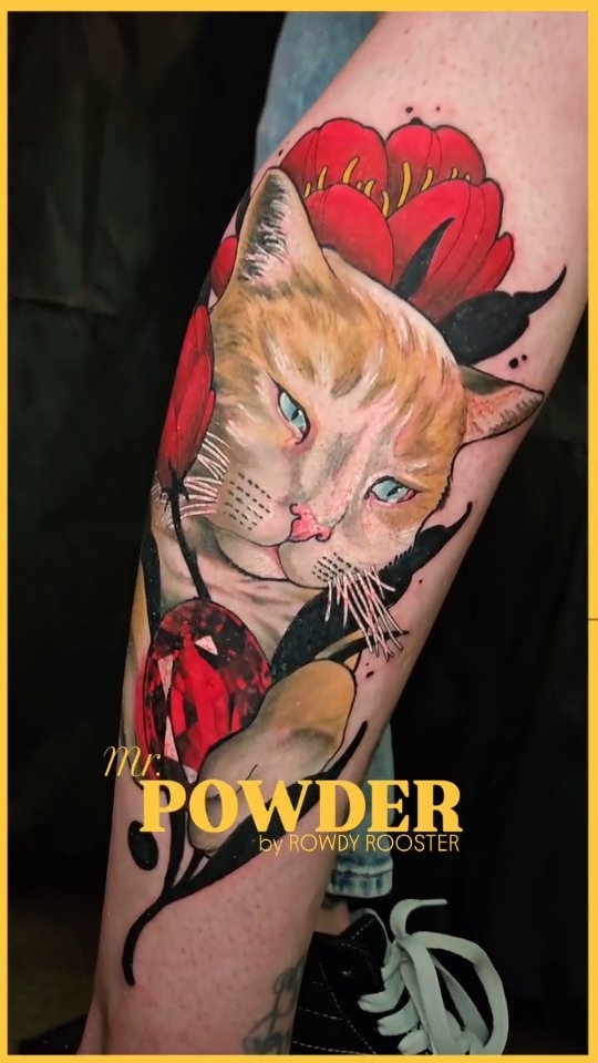 Cat portrait tattoo with red flowers, calf