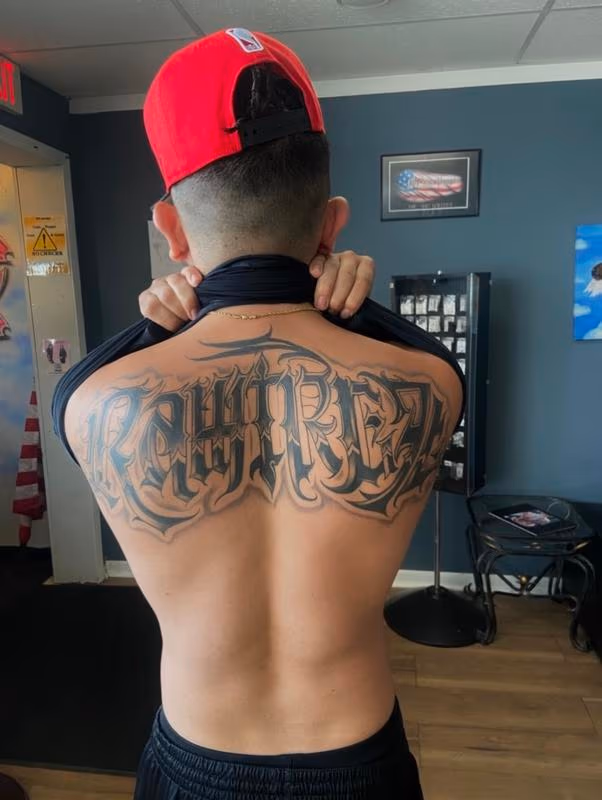 Black and grey script back piece