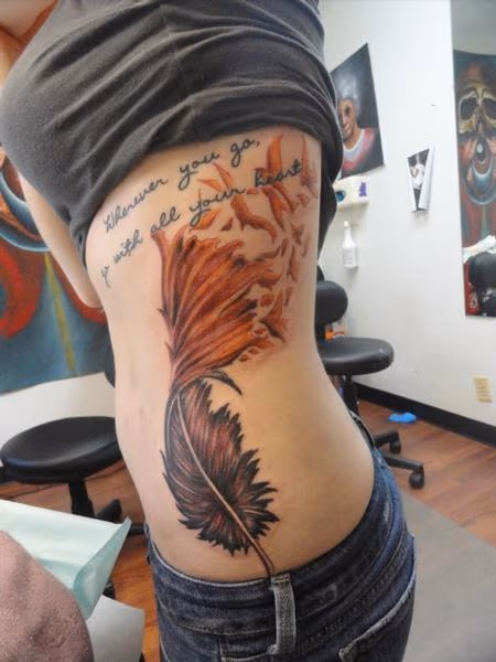 Custom feather tattoo with script
