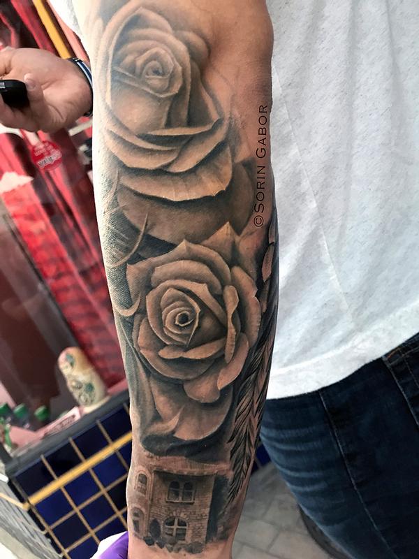 realistic black and gray girl face w/bandana, roses, and Sonoma City Hall building tatoo sleeve