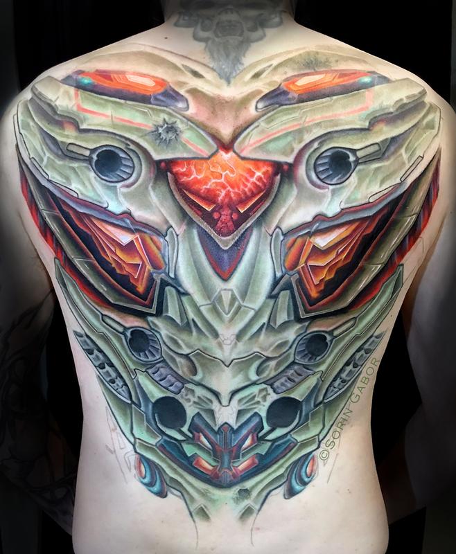 Realistic color futuristic armor biomech back tattoo