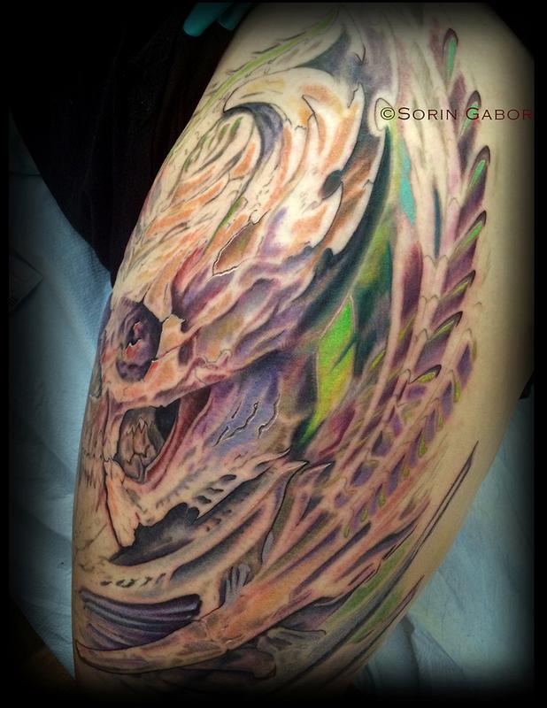 realistic color bio organic skull tattoo