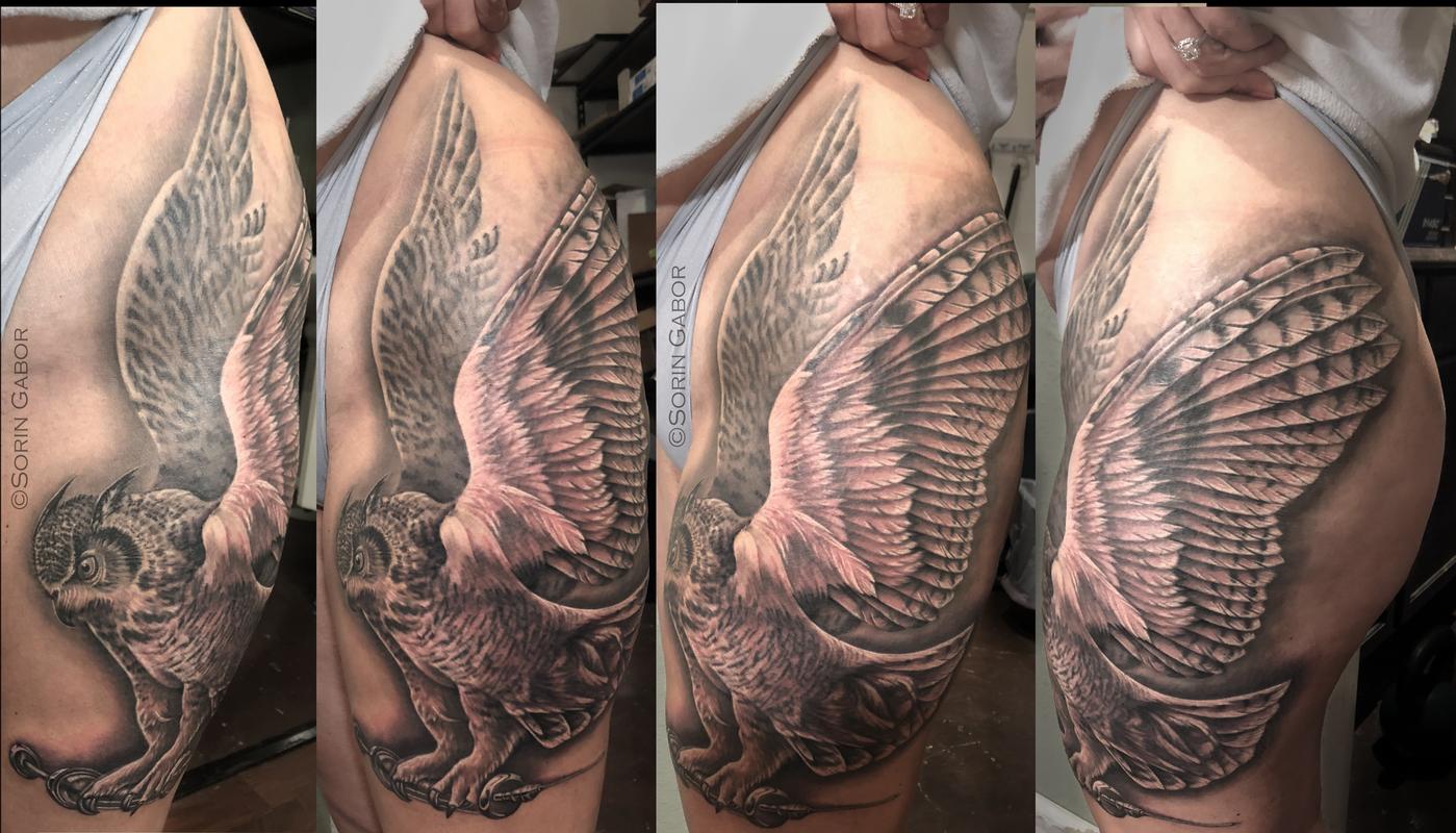 Realistic black and gray owl with syringe tattoo