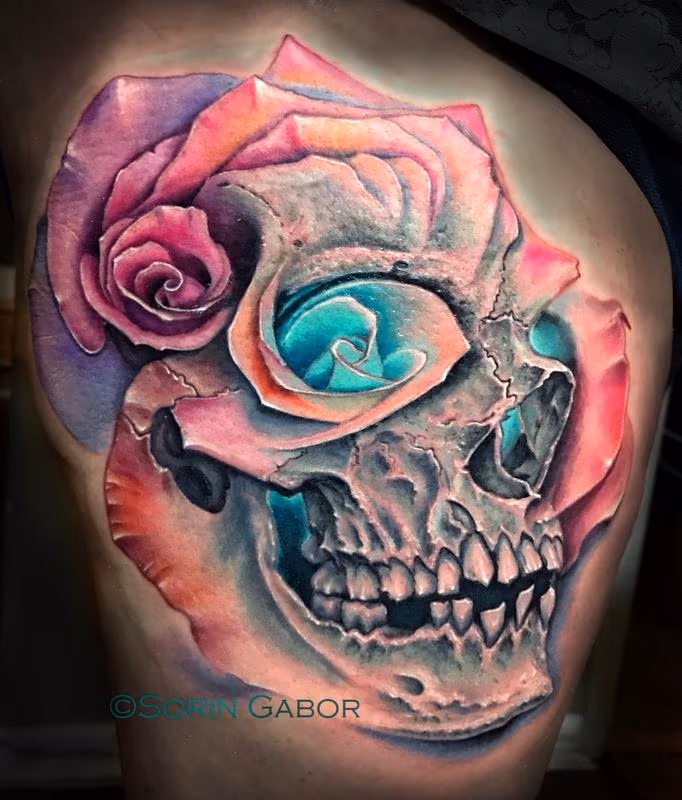 realistic color skull and multiple rose morph tattoo