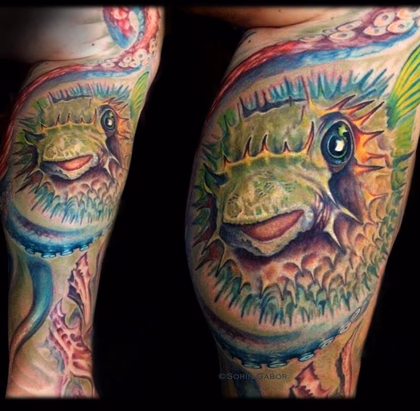 realistic color puffer fish and octopus tattoo