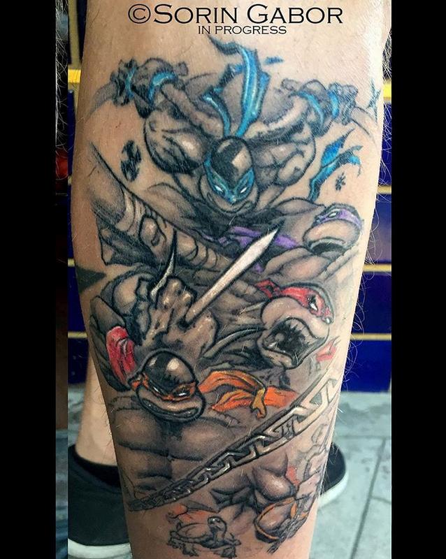 black and gray ninja turtles with color details tattoo