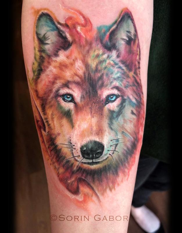 Realistic color watercolor wolf tattoo