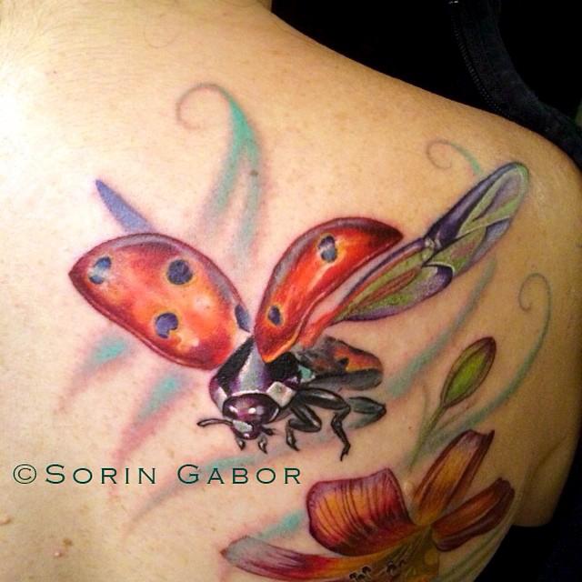 Realistic color flower and ladybug tattoo-ladybug detail