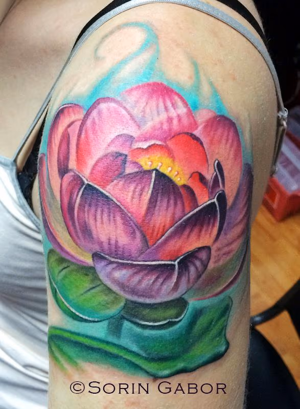 realistic color lotus tattoo on shoulder