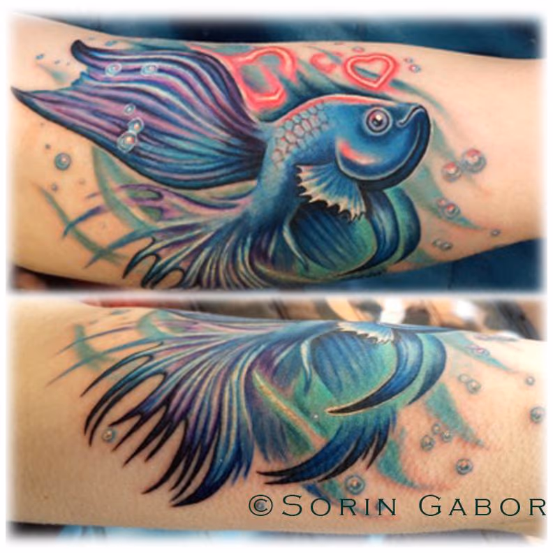 Realistic feminine color beta fish memorial tattoo