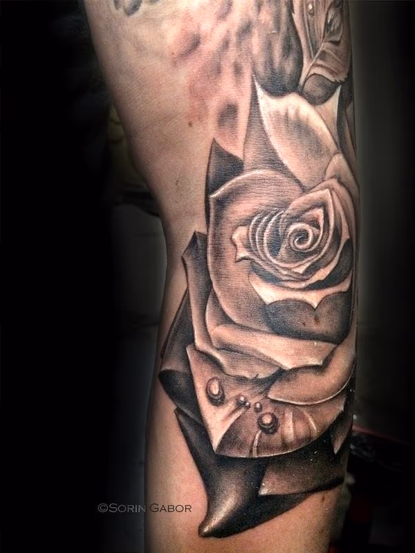 realistic black and gray rose tattoo