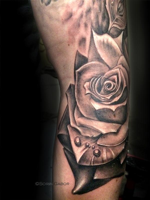 realistic black and gray rose tattoo