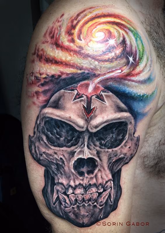 Realistic black and gray gorilla skull with color space tattoo