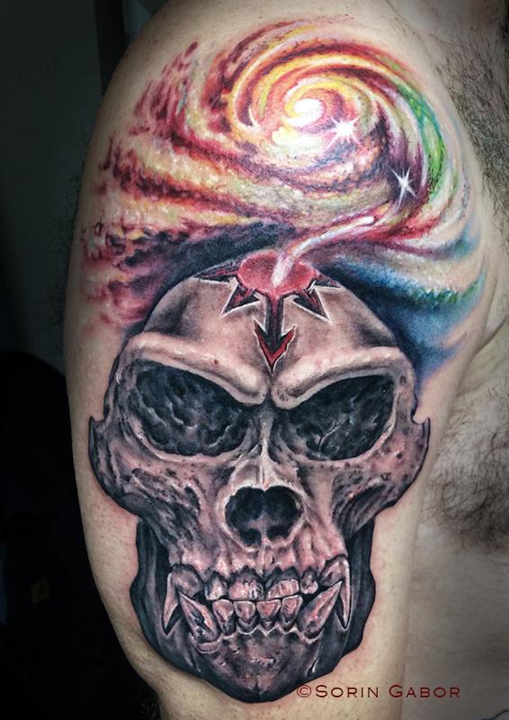 Realistic black and gray gorilla skull with color space tattoo