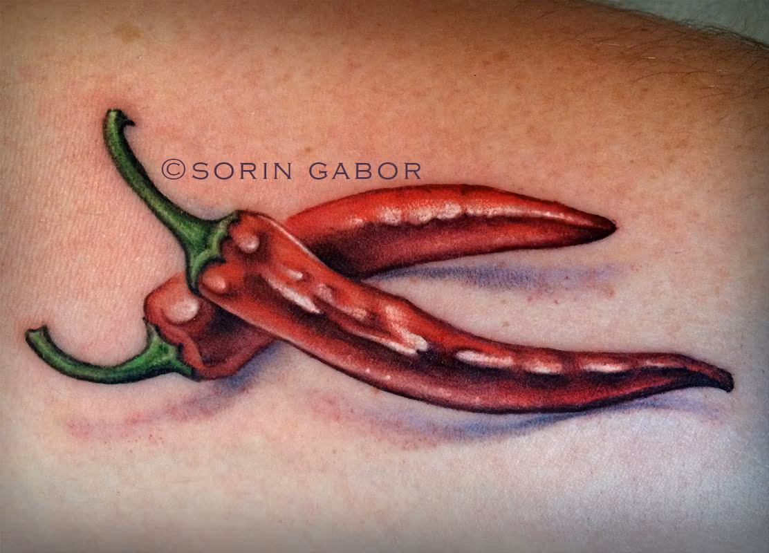 Realistic hot peppers color tattoo