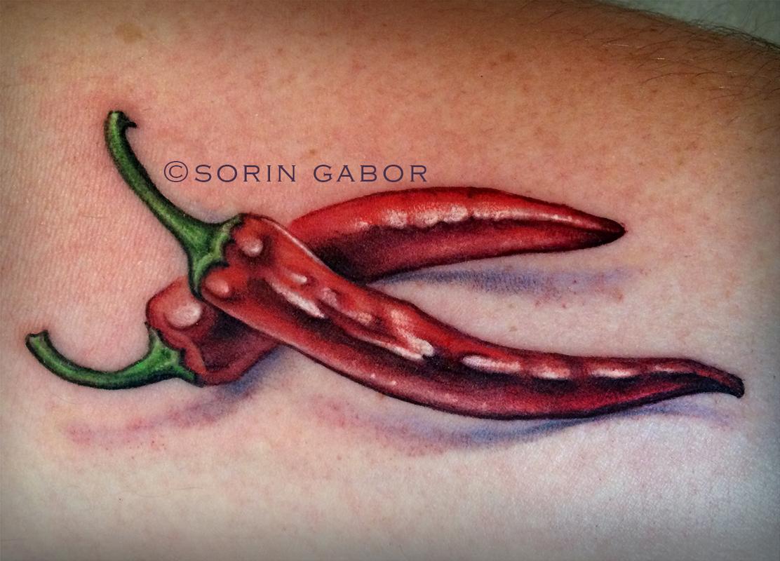 Realistic hot peppers color tattoo