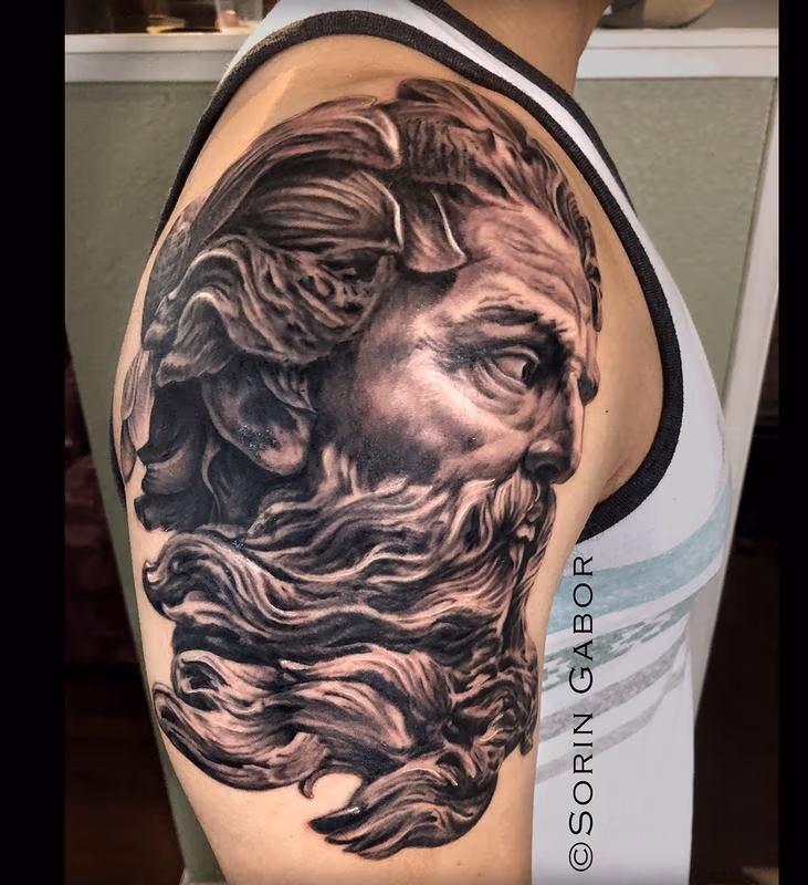 Realistic black and gray Zeus tattoo