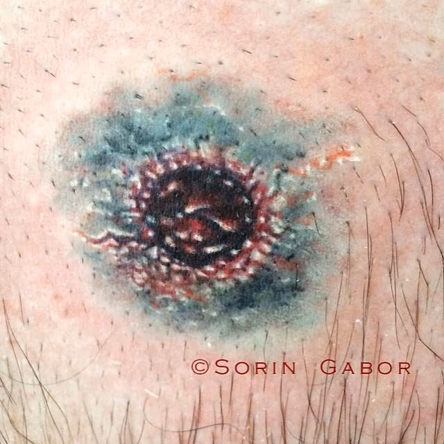 realistic color bullet hole tattoo on chest- entry wound