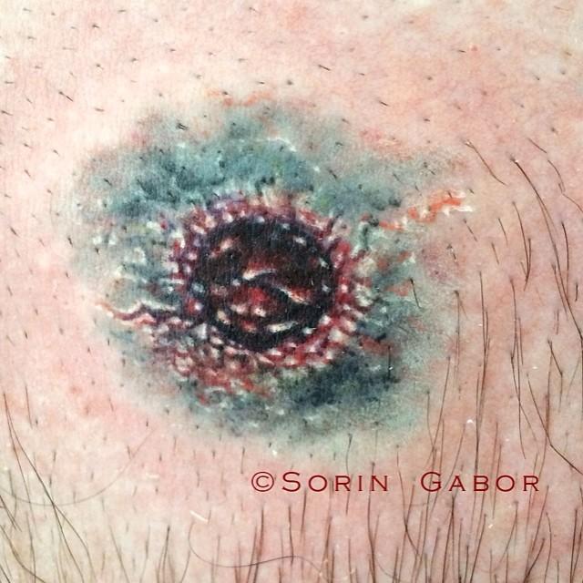 realistic color bullet hole tattoo on chest- entry wound