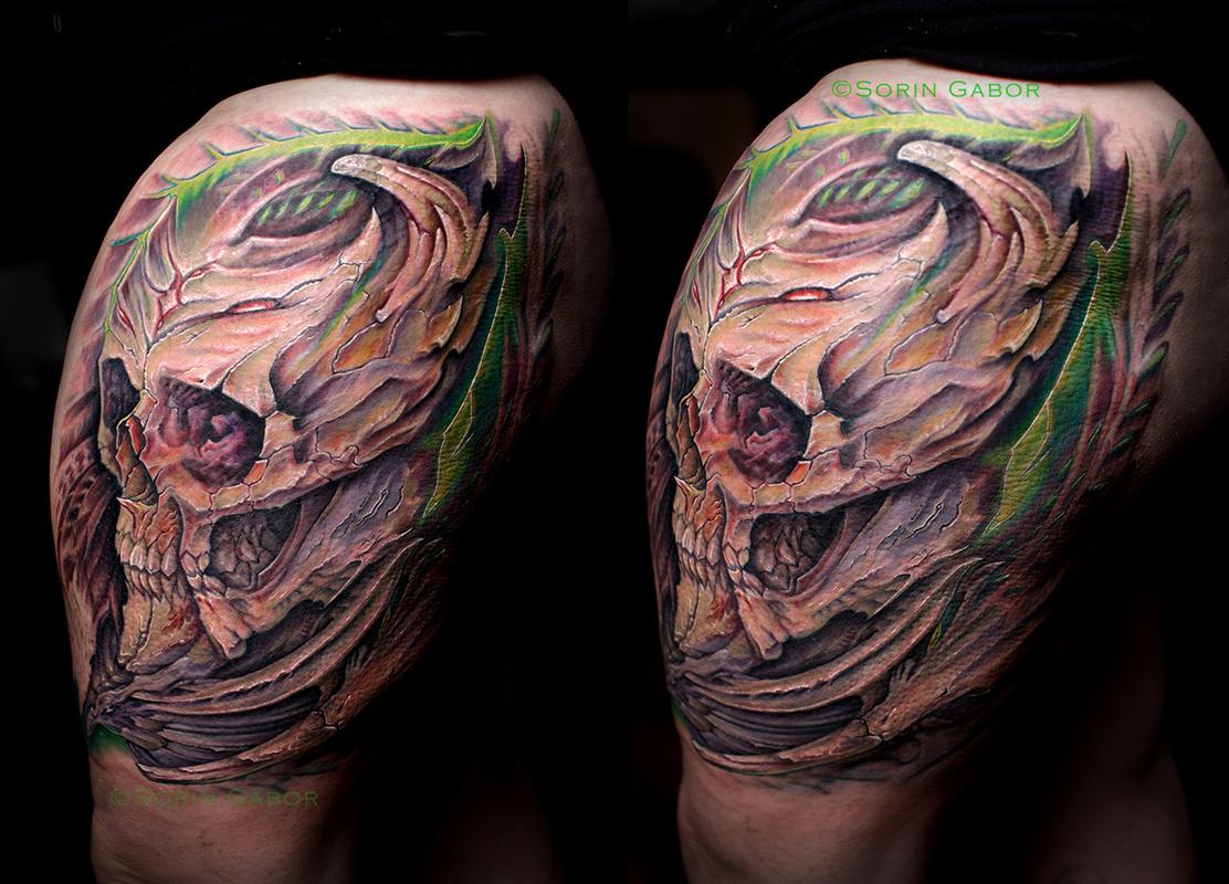 Realistic custom color bio organic skull mech thigh tattoo