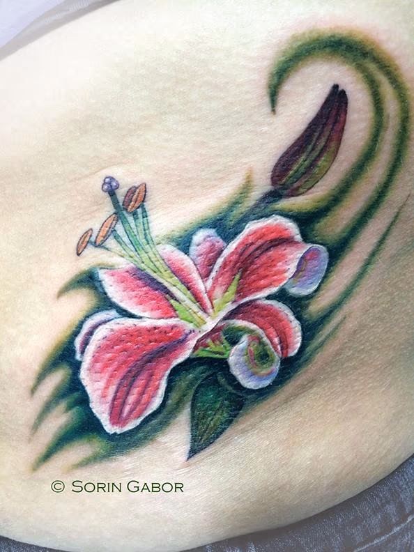 Stargazer Lily tattoo on ribs