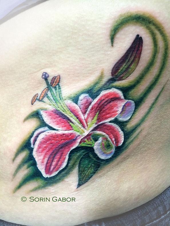 Stargazer Lily tattoo on ribs