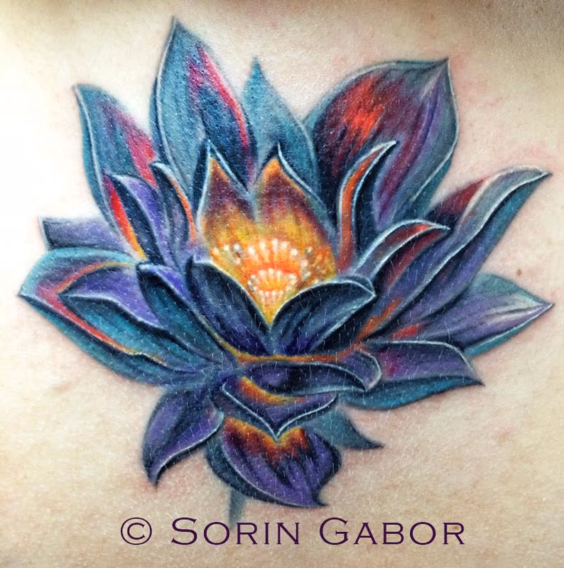realistic color lotus coverup over old scarred tattoo