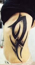 Black and gray tribal on ribs